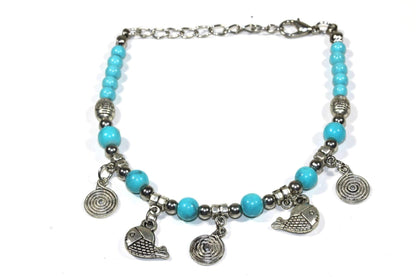 Turquoise Beaded Fish Charm Bracelet With Spiral Charms